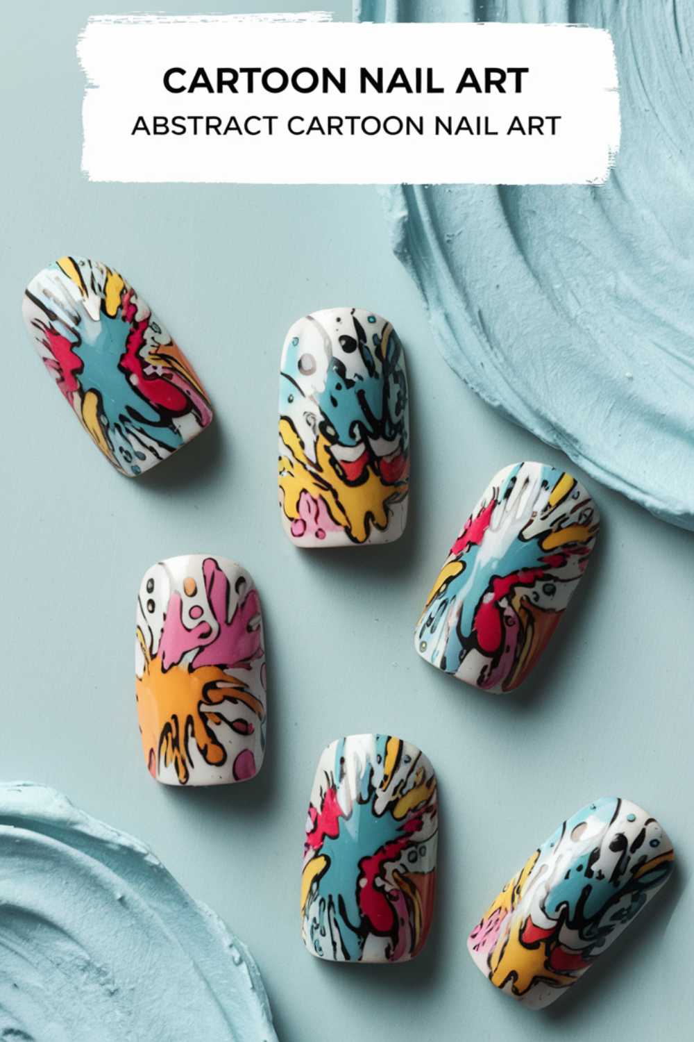 Abstract cartoon nail art on six nails showcases vibrant splashes in blue, red, yellow, and pink against a white backdrop. Near the nails are textured pastel blue smears. Text above reads: Cartoon Nail Art Designs - Abstract Cartoon Nail Art.