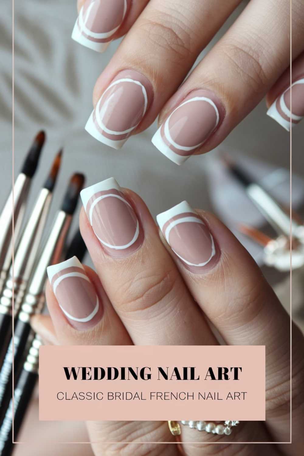 Close-up of hands with French manicure nails featuring white tips and a circle design. Brushes are visible in the background. Text reads: Wedding Nail Art - Classic Bridal French Nail Art.
