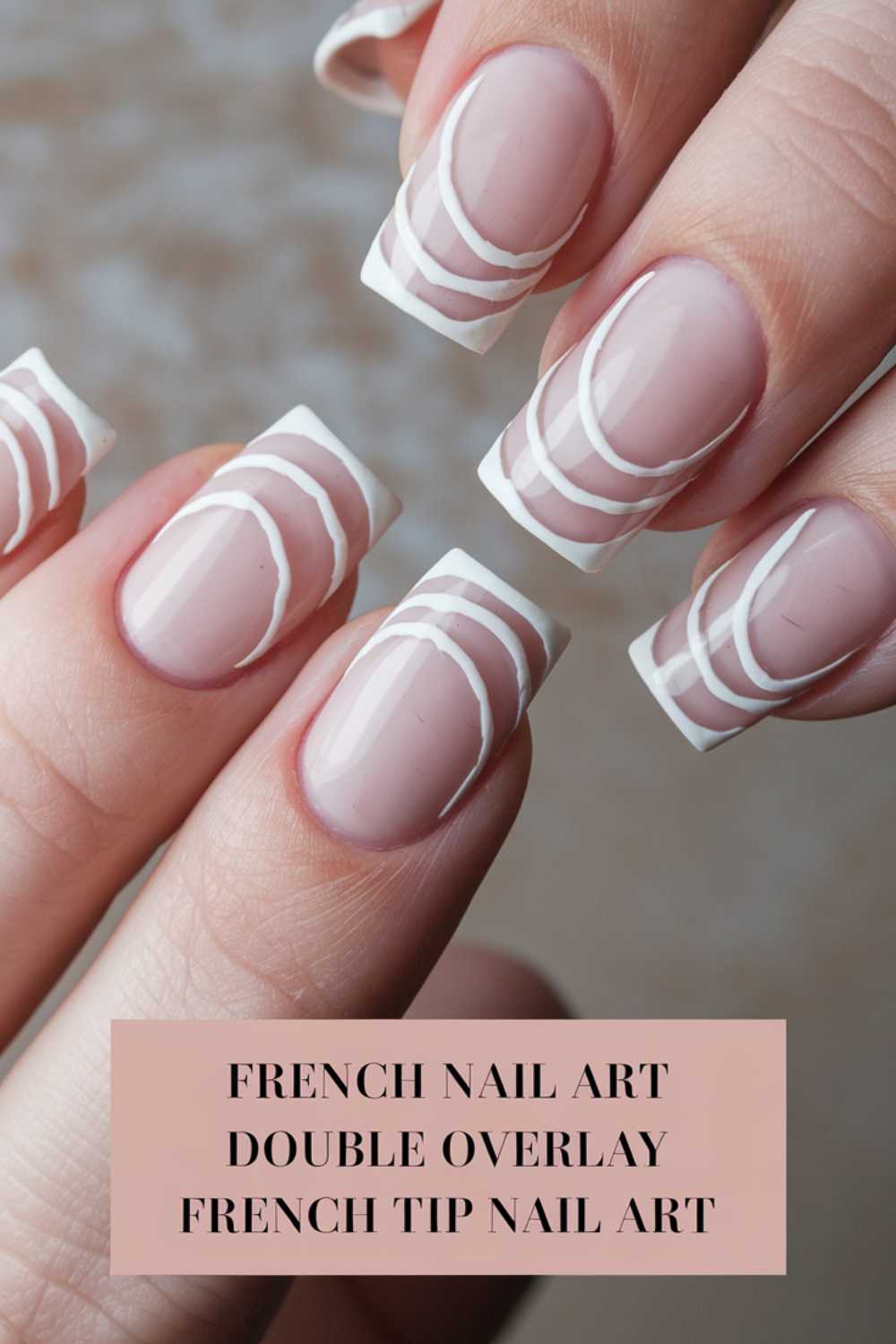Close-up of fingernails with French tip nail art featuring a double white overlay design. Light pink background with text: French Nail Art Double Overlay French Tip Nail Art.