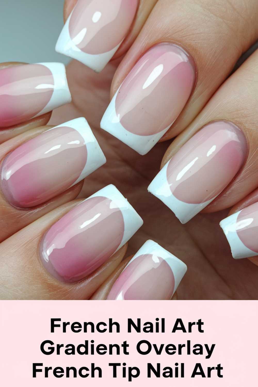 Close-up of a hand with a French manicure. Nails have a gradient overlay with a pink base and white tips, showcasing a glossy finish. The background features text: French Nail Art, Gradient Overlay, French Tip Nail Art.