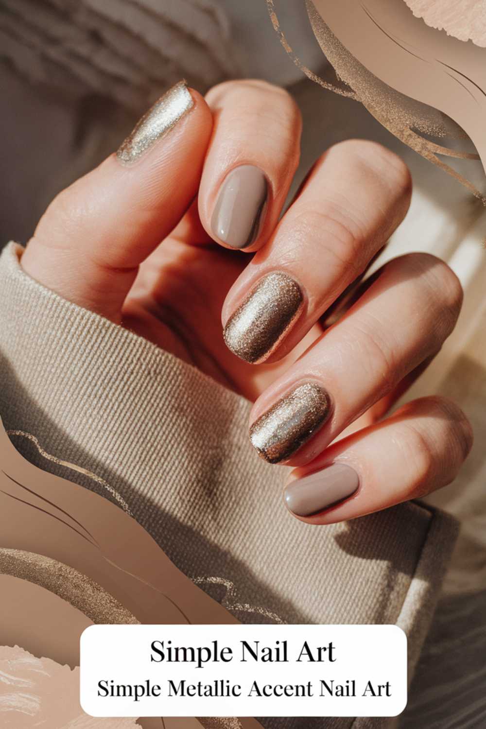 A hand showcases a simple nail art design with two metallic glittery nails and three taupe ones. The person dons a beige long-sleeve top, and the design features soft, abstract shapes around the edges. Text at the bottom reads Simple Metallic Accent Nail Art.