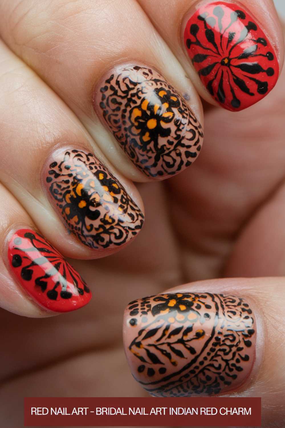 Close-up of a hand with intricate henna-inspired nail art. The nails feature black and orange floral and leaf patterns on a nude base, with one nail painted in vibrant red featuring a black and red flower design.