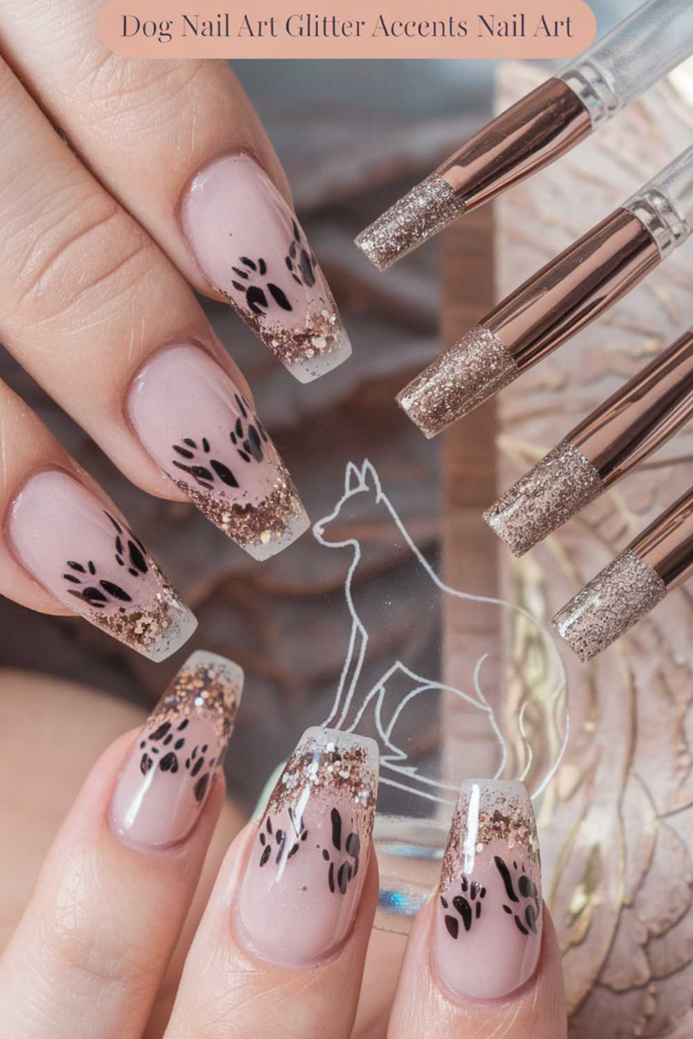 A close-up of hands showcases stunning dog nail art, featuring nails with a transparent base, glittery tips, and black dog paw prints. Brush tips with gold glitter adorn the top right corner. A dogs silhouette is etched on a clear disk nestled between two fingers.