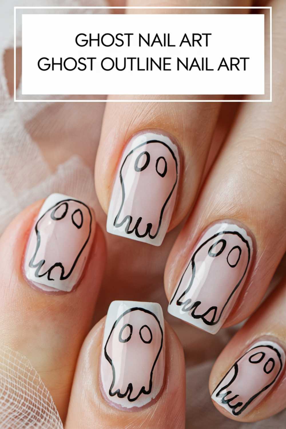 Close-up of fingernails with clear polish featuring ghost outline nail art. Each nail has a simple black-outlined ghost with two circular eyes, creating a playful and spooky effect.