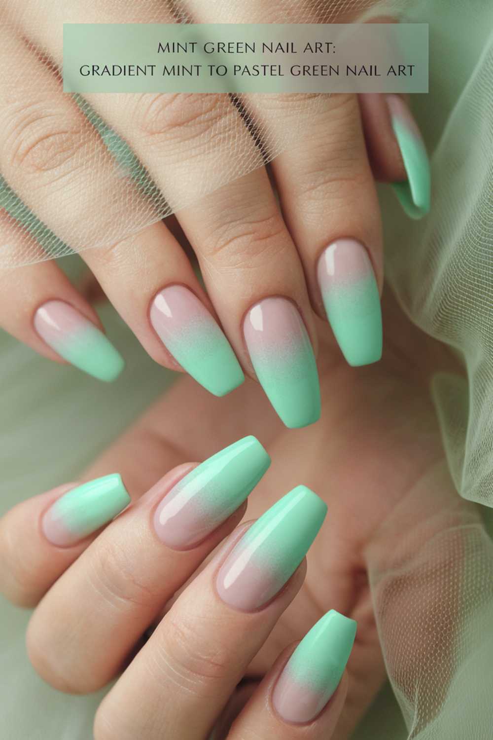 Close-up of hands with long nails featuring a mint green gradient manicure, transitioning from natural pink at the base to pastel mint green tips. A sheer fabric is draped in the background. Text label at the top highlights this chic green nail art.