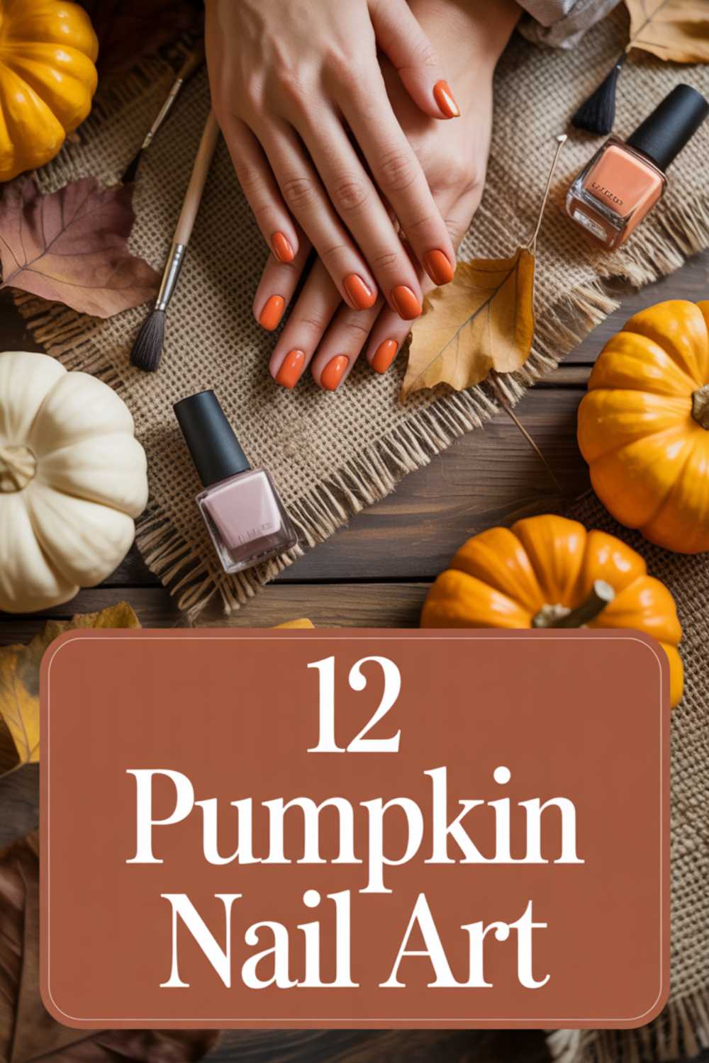A womans hands with orange pumpkin-colored nail polish rest on a table with nail polish bottles, autumn leaves, and small pumpkins. Text reads 12 Pumpkin Nail Art.