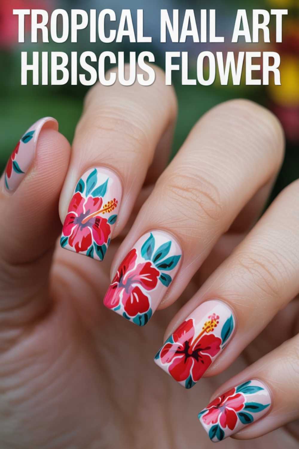 A hand with nails painted in tropical nail art featuring vibrant red hibiscus flowers with green leaves on a light pink base. Text at the top reads Tropical Nail Art Hibiscus Flower.