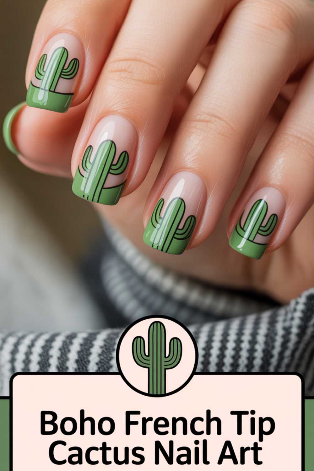 A close-up of a hand with nails painted in a French tip style featuring green cactus designs. The text below reads, Boho French Tip Cactus Nail Art, with a cartoon cactus icon above the words.